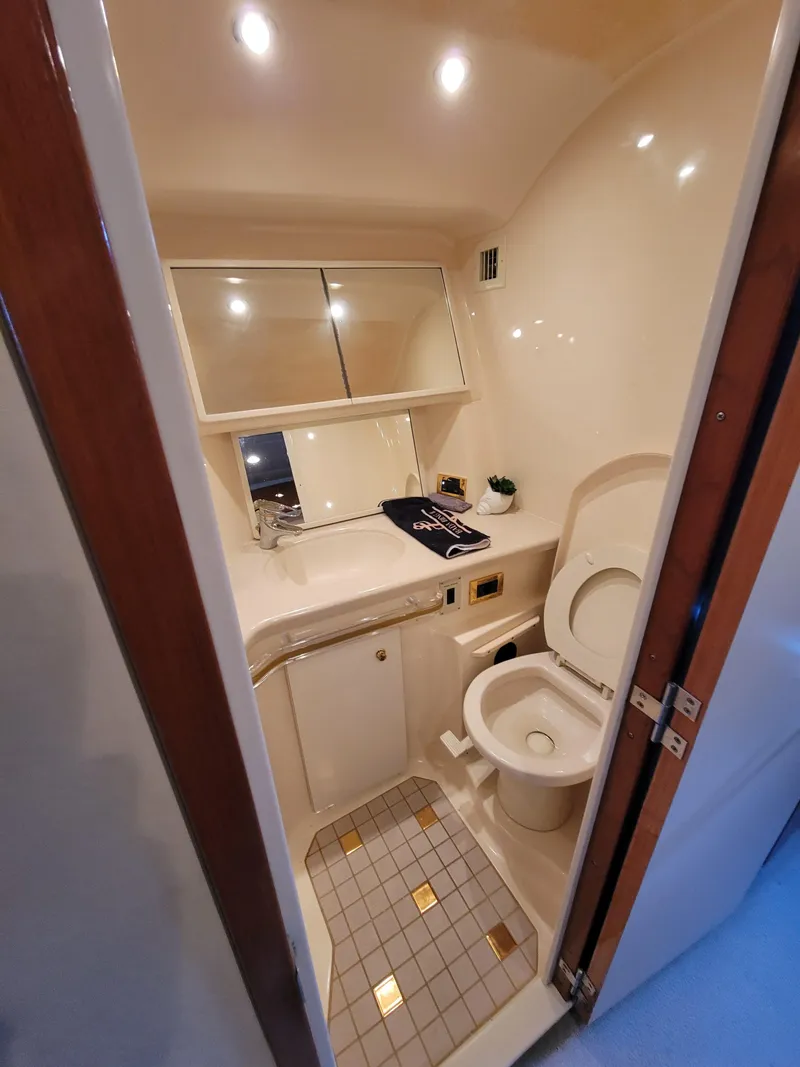 Slide: The Image of Bathroom interior of 2000 Sea Ray 540 Sundancer yacht with toilet and sink. - 36
