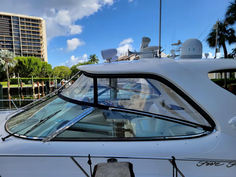 Slide: The Image of 2000 Sea Ray 540 Sundancer docked at marina with clear blue sky. - 5