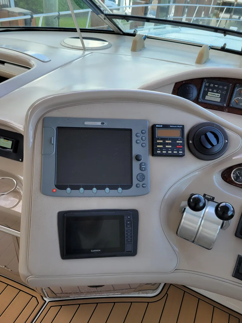 Slide: The Image of Control panel of a 2000 Sea Ray 540 Sundancer yacht with navigation equipment. - 14