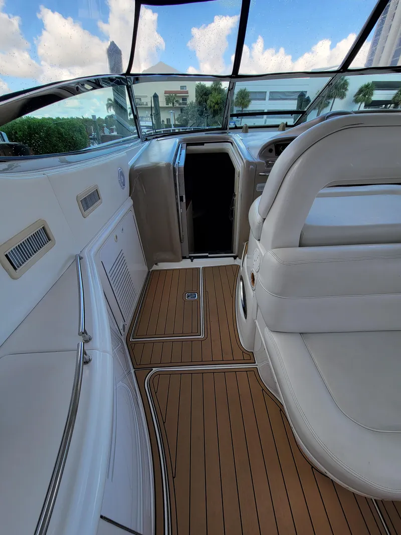 Slide: The Image of Interior view of 2000 Sea Ray 540 Sundancer yacht with teak flooring. - 9