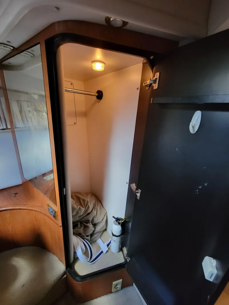 Slide: The Image of Interior closet of a 2000 Sea Ray 540 Sundancer yacht. - 48