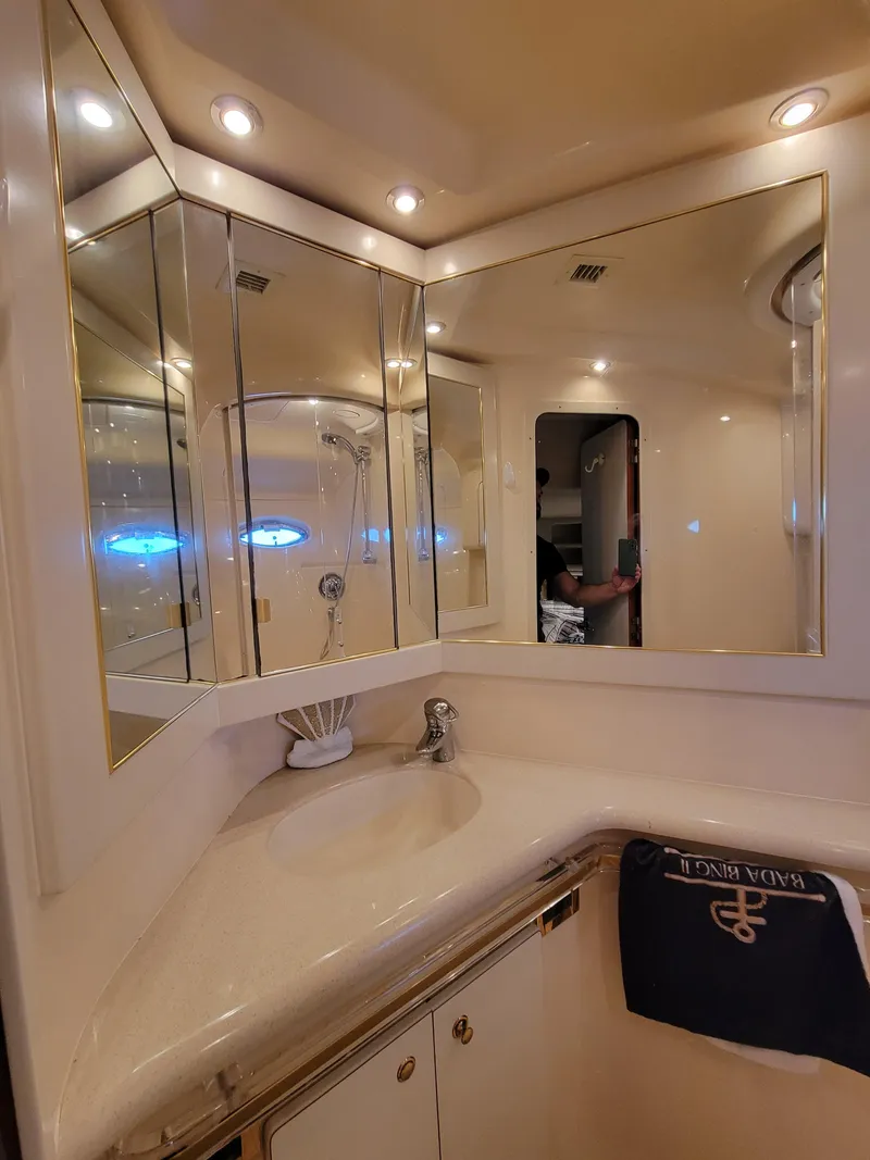 Slide: The Image of Luxurious bathroom on a 2000 Sea Ray 540 Sundancer yacht with mirrored cabinets. - 35