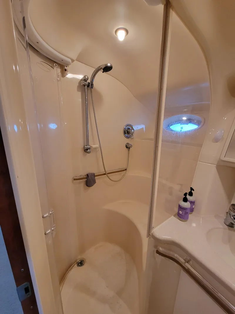 Slide: The Image of 2000 Sea Ray 540 Sundancer bathroom with shower and sink. - 37