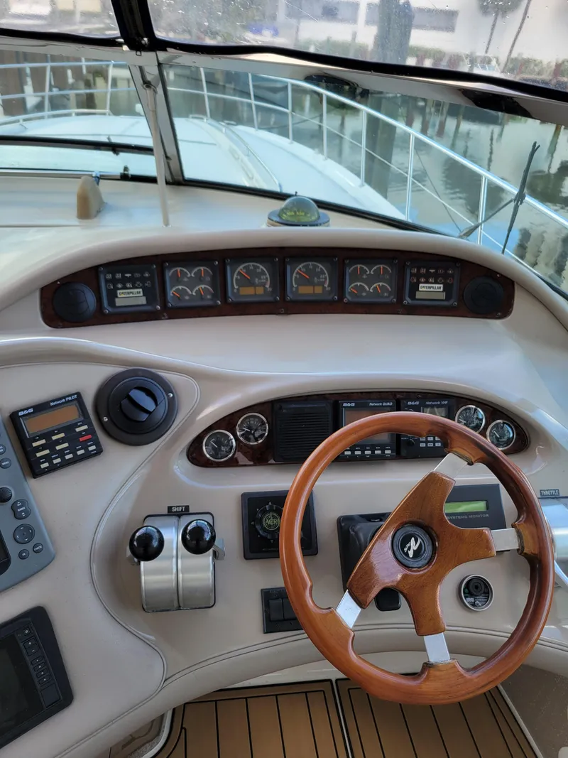 Slide: The Image of Cockpit of 2000 Sea Ray 540 Sundancer with wooden steering wheel and instrument panel. - 15