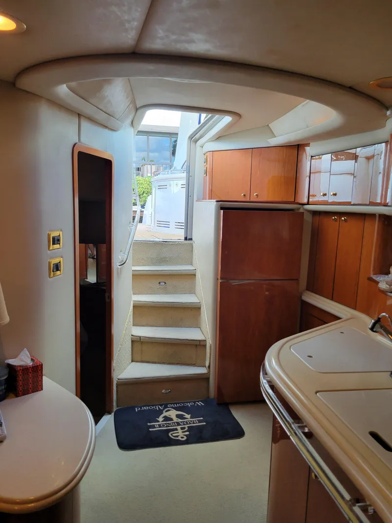 Slide: The Image of Interior of 2000 Sea Ray 540 Sundancer yacht with stairs leading to deck. - 44