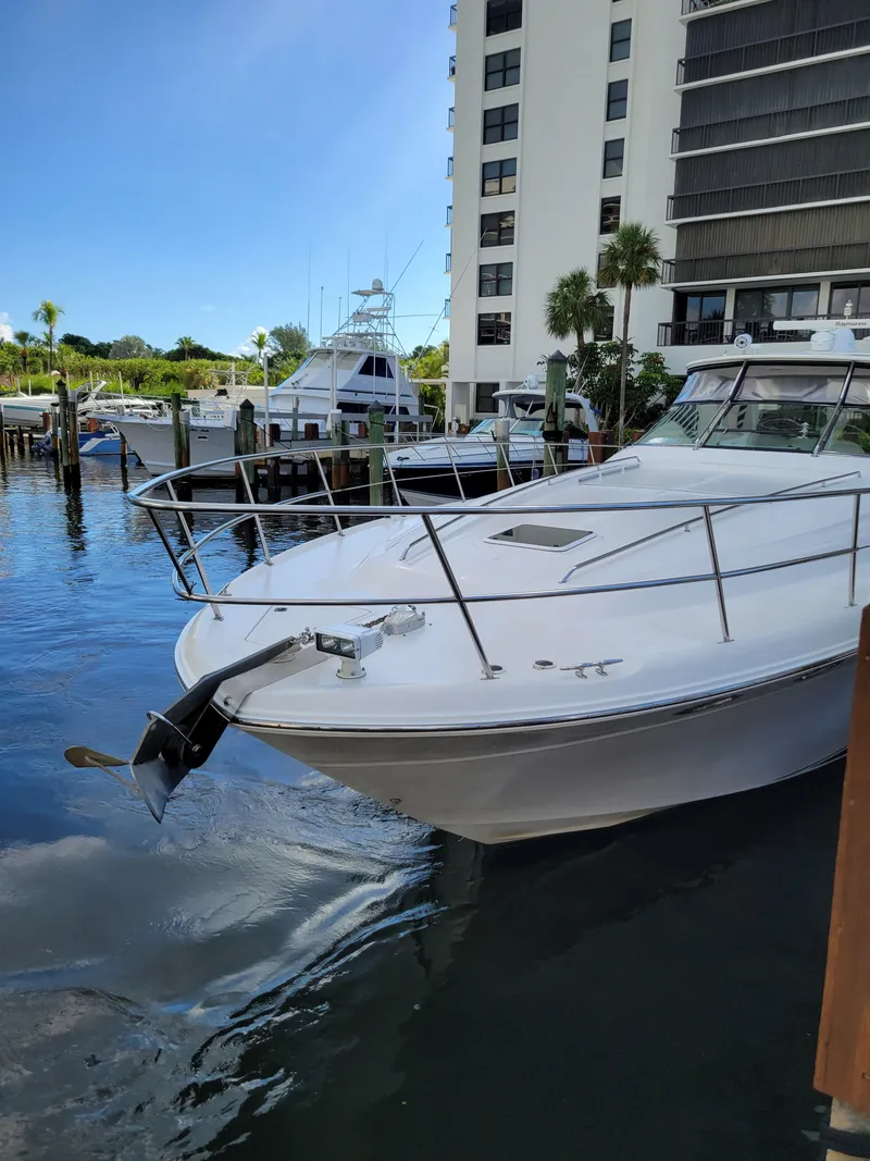 Slide: The Image of 2000 Sea Ray 540 Sundancer docked near waterfront buildings. - 6