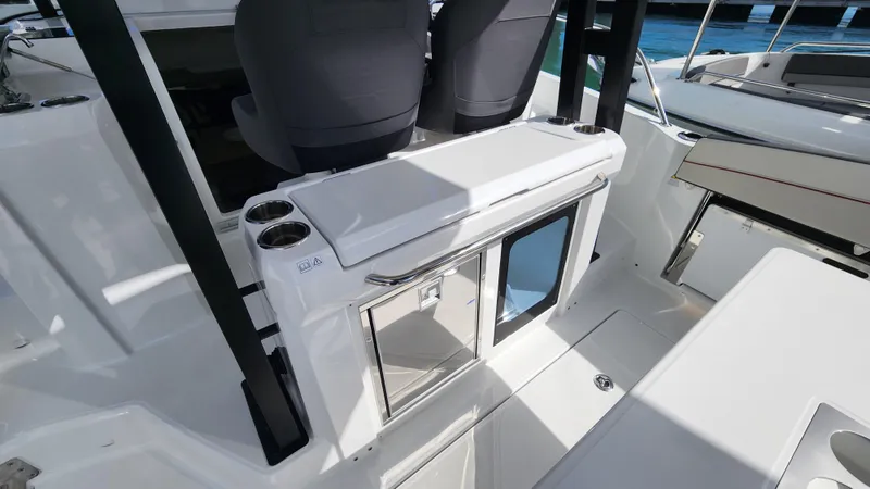 Slide: The Image of 2024 Jeanneau Leader 9.0 WA S2 cockpit with seating and storage. - 13