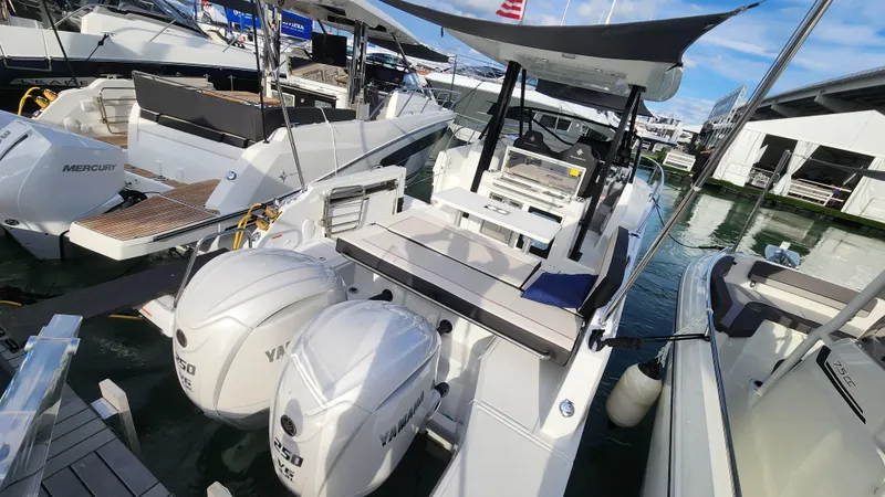 Slide: The Image of 2024 Jeanneau Leader 9.0 WA S2 boat with twin Yamaha outboard engines docked. - 19