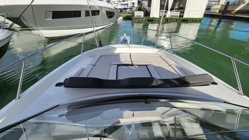Slide: The Image of 2024 Jeanneau Leader 9.0 WA S2 boat docked, featuring spacious sunbathing area. - 22