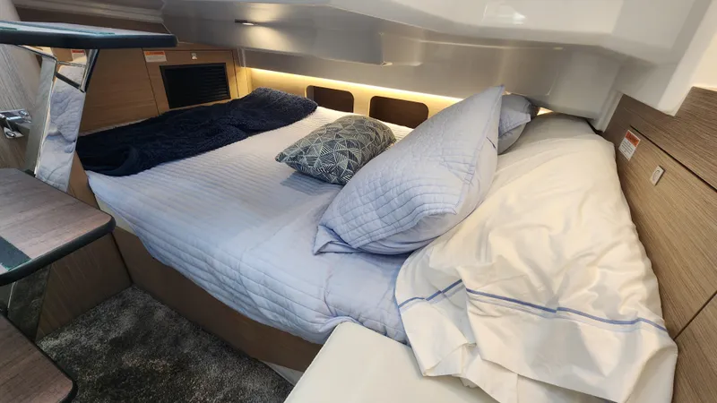 Slide: The Image of 2024 Jeanneau Leader 9.0 WA S2 cabin with cozy bed and modern interior. - 32