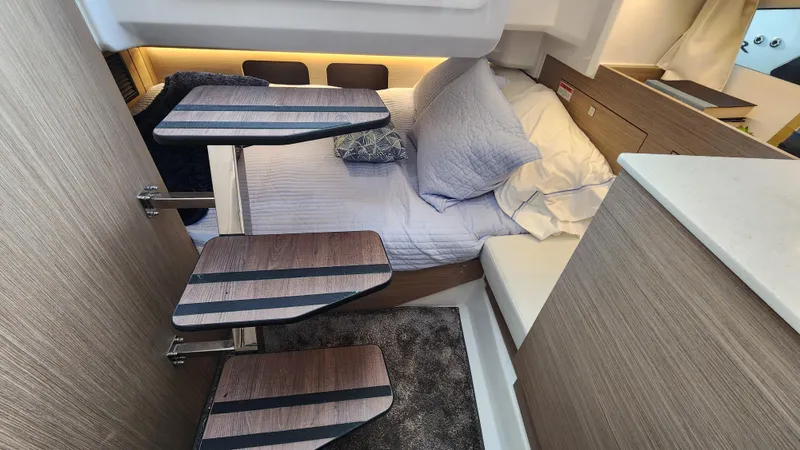 Slide: The Image of Interior cabin of 2024 Jeanneau Leader 9.0 WA S2 with cozy bed and modern design. - 34
