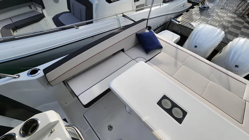 Slide: The Image of 2024 Jeanneau Leader 9.0 WA S2 boat interior with seating and table. - 38