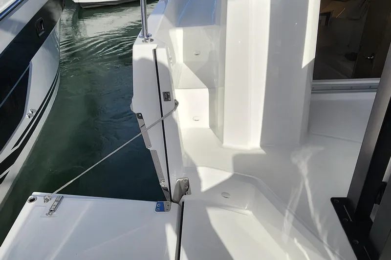 Slide: The Image of 2024 Jeanneau Leader 9.0 WA S2 boat deck and water view. - 41