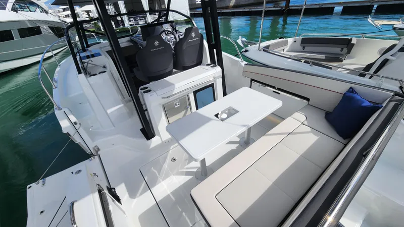 Slide: The Image of 2024 Jeanneau Leader 9.0 WA S2 boat interior with seating and table. - 8