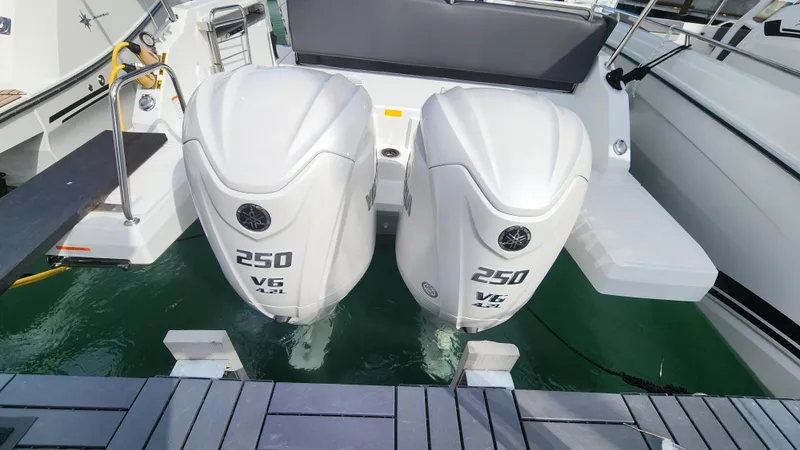 Slide: The Image of 2024 Jeanneau Leader 9.0 WA S2 with twin 250 HP V6 outboard engines. - 9