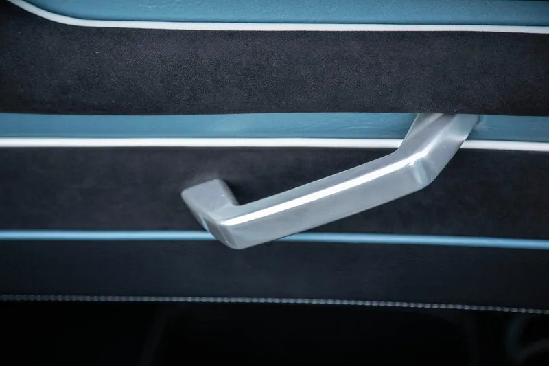 Slide: The Image of Close-up of 2025 Fountain 34 Thunder Cat interior door handle. - 10