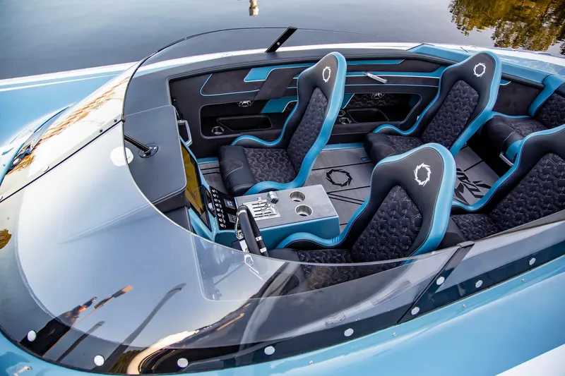 Slide: The Image of Interior of a 2025 Fountain 34 Thunder Cat speedboat with modern seating and dashboard. - 3