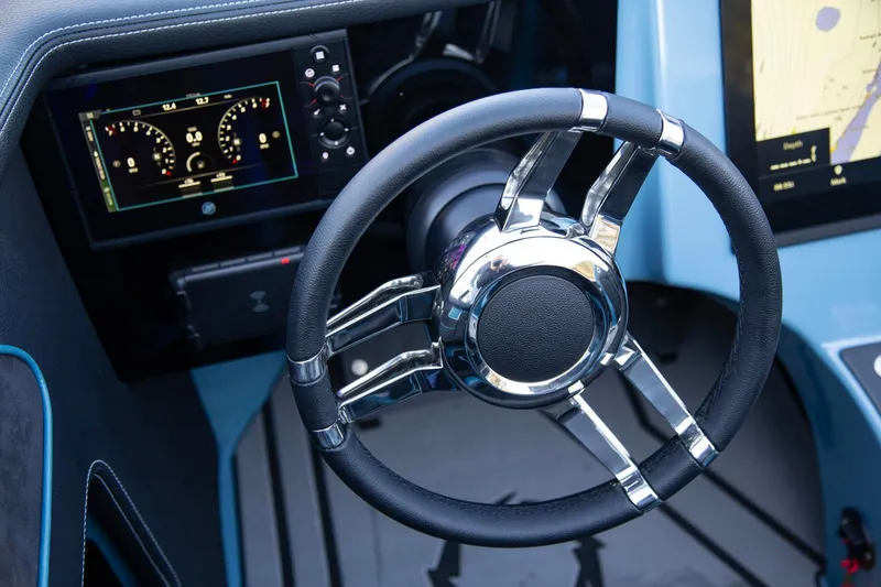 Slide: The Image of Steering wheel and dashboard of 2025 Fountain 34 Thunder Cat boat. - 7