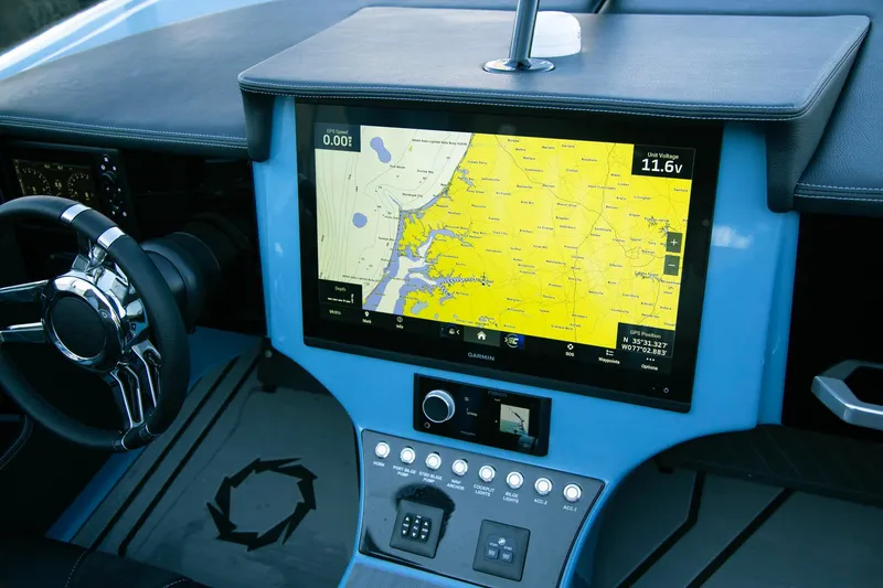 Slide: The Image of 2025 Fountain 34 Thunder Cat dashboard with navigation screen and controls. - 8
