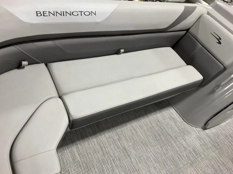 Slide: The Image of 2024 Bennington 21 SXL boat interior seating with gray upholstery. - 13