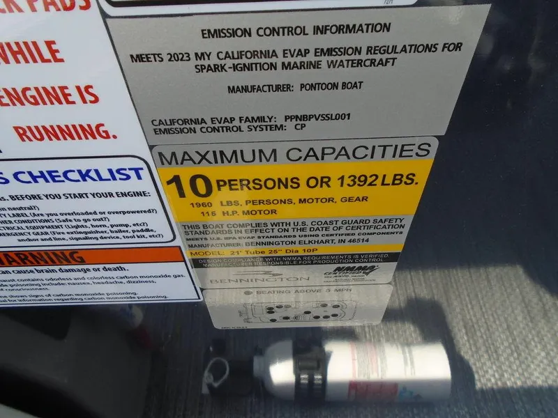 Slide: The Image of 2024 Bennington 21 SXL capacity label: 10 persons or 1392 lbs, emission control info. - 21
