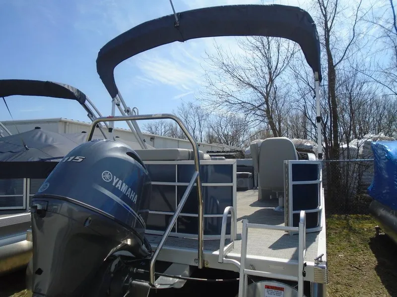 Slide: The Image of 2024 Bennington 21 SXL pontoon boat with Yamaha outboard motor. - 4