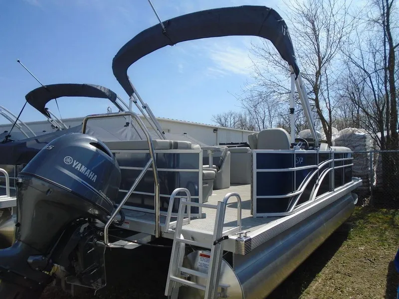 Slide: The Image of 2024 Bennington 21 SXL pontoon boat with Yamaha outboard motor. - 8
