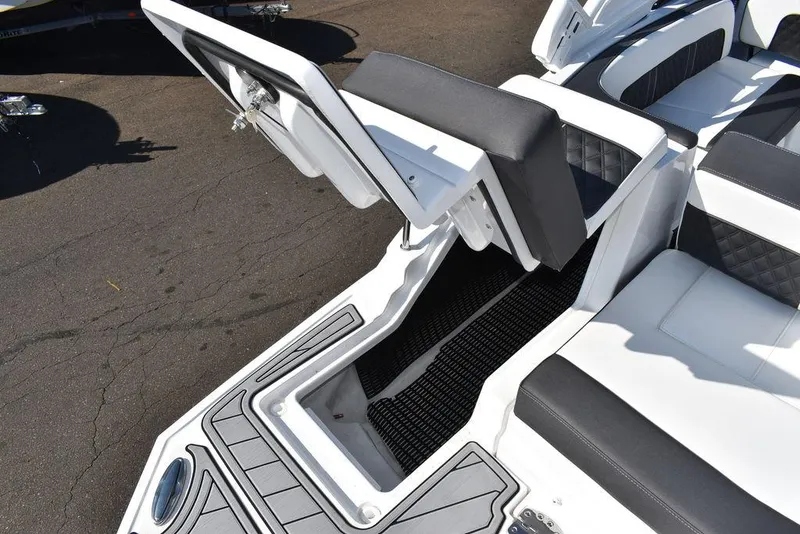 Slide: The Image of 2024 Monterey M-45 boat with open storage compartment and cushioned seating. - 14