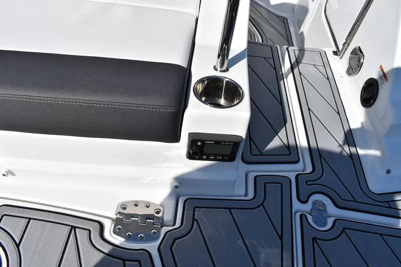 Slide: The Image of 2024 Monterey M-45 boat interior with cushioned seating and cup holder. - 21