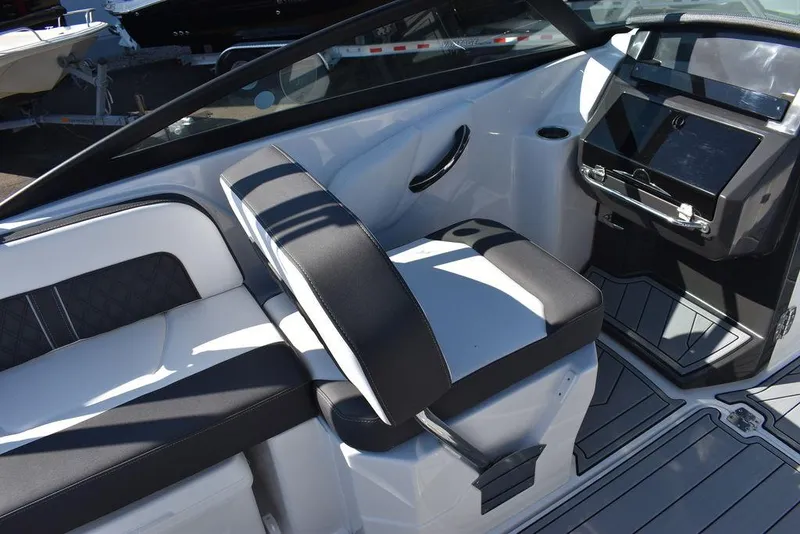 Slide: The Image of 2024 Monterey M-45 boat interior with black and white seating and modern dashboard. - 24