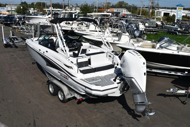 Slide: The Image of 2024 Monterey M-45 boat on trailer in marina, rear view. - 3