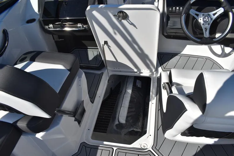 Slide: The Image of 2024 Monterey M-45 boat interior with open storage compartment and modern seating. - 32