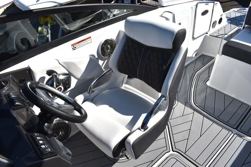 Slide: The Image of 2024 Monterey M-45 boat cockpit with captain's chair and steering wheel. - 33