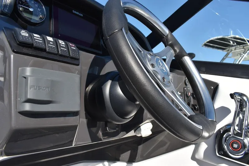 Slide: The Image of 2024 Monterey M-45 boat dashboard with steering wheel and control panel. - 36