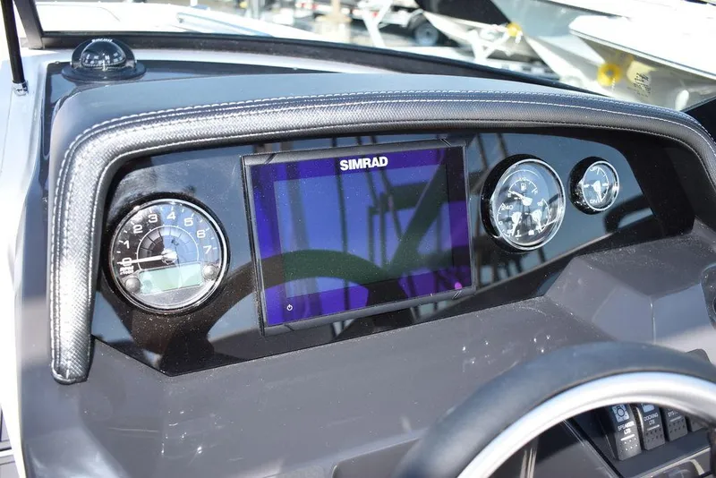 Slide: The Image of 2024 Monterey M-45 boat dashboard with Simrad display and gauges. - 37