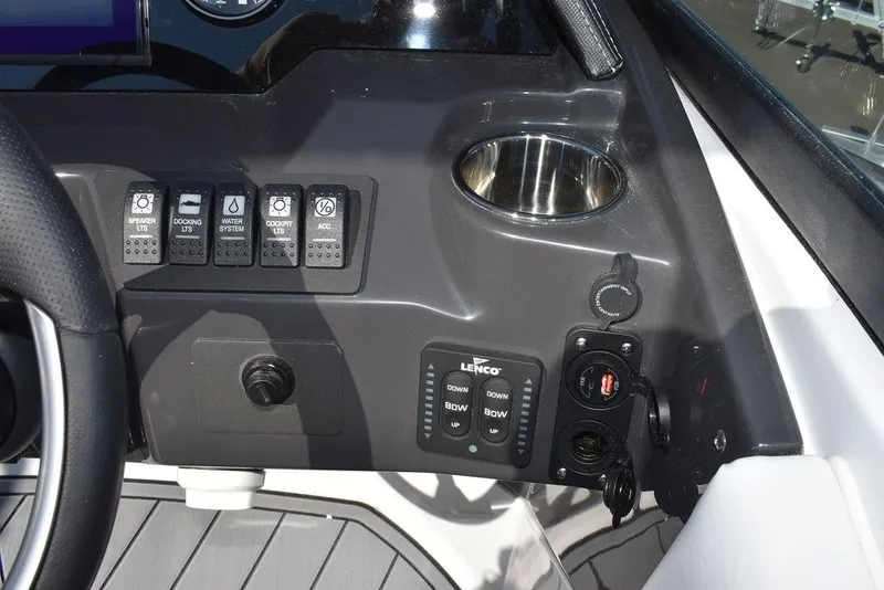 Slide: The Image of Control panel of 2024 Monterey M-45 boat with switches and cup holder. - 38