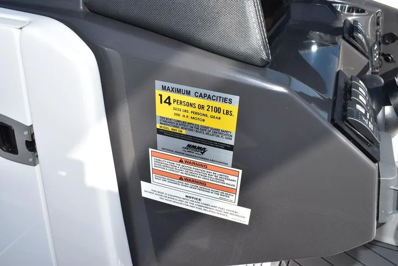 Slide: The Image of 2024 Monterey M-45 boat capacity label, 14 persons or 2100 lbs. - 41