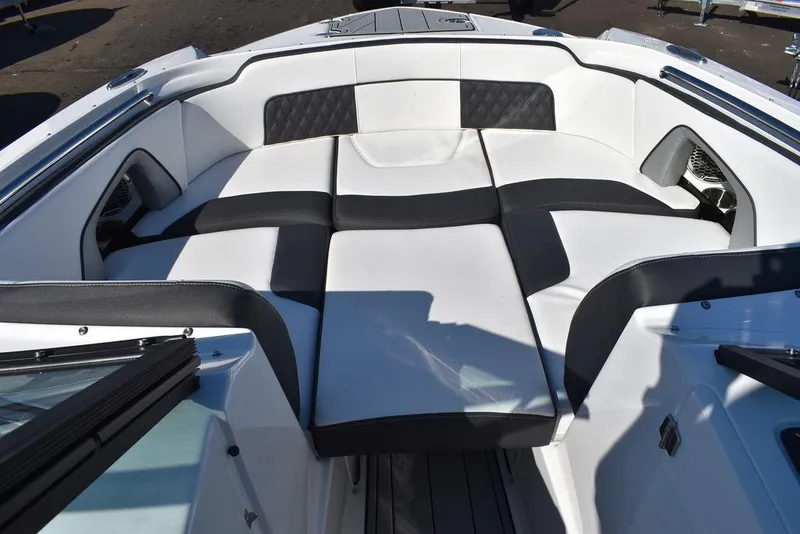 Slide: The Image of 2024 Monterey M-45 boat interior with white and black cushioned seating. - 46