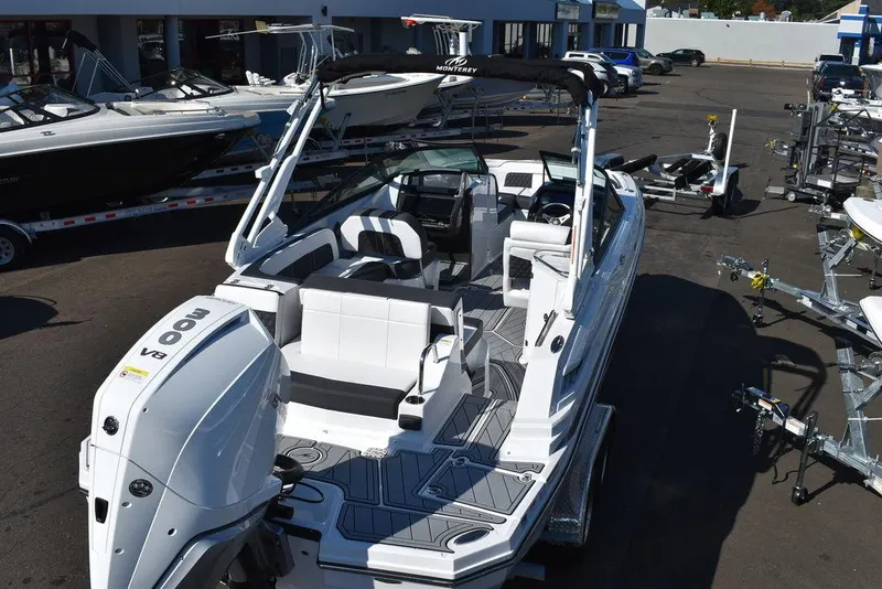 Slide: The Image of 2024 Monterey M-45 boat with outboard motor, docked at a marina. - 6