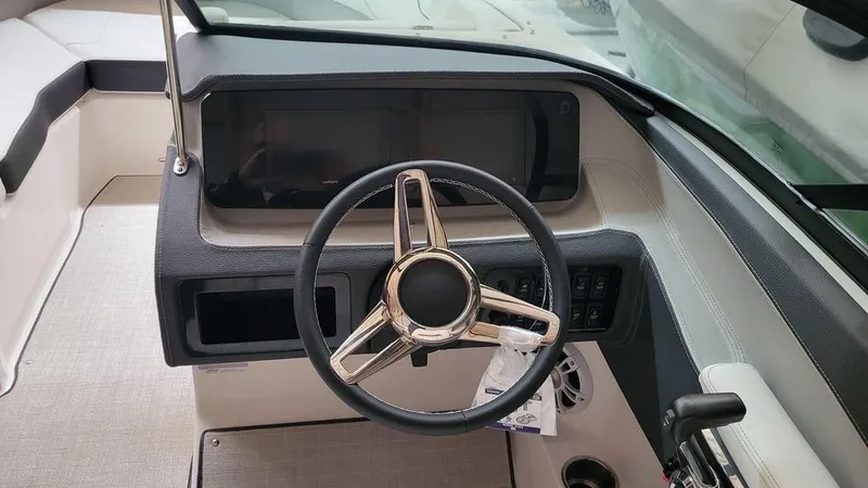 Slide: The Image of 2024 Regal LS2 boat dashboard with steering wheel and control panel. - 11