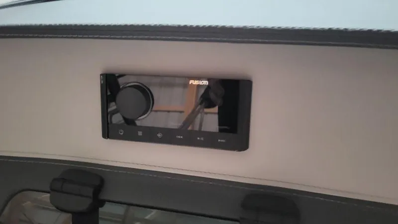 Slide: The Image of 2024 Regal LS2 boat stereo system with Fusion audio controls. - 12