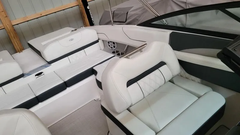 Slide: The Image of 2024 Regal LS2 boat interior with white and black seating, modern design. - 8