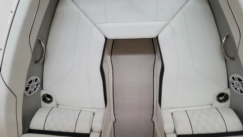 Slide: The Image of 2024 Regal LS2 boat interior with white leather seating and built-in speakers. - 9