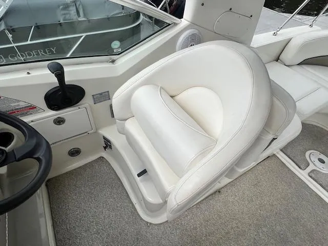 Slide: The Image of 2005 Sea Ray 260 Sundancer helm seat and cockpit area. - 14