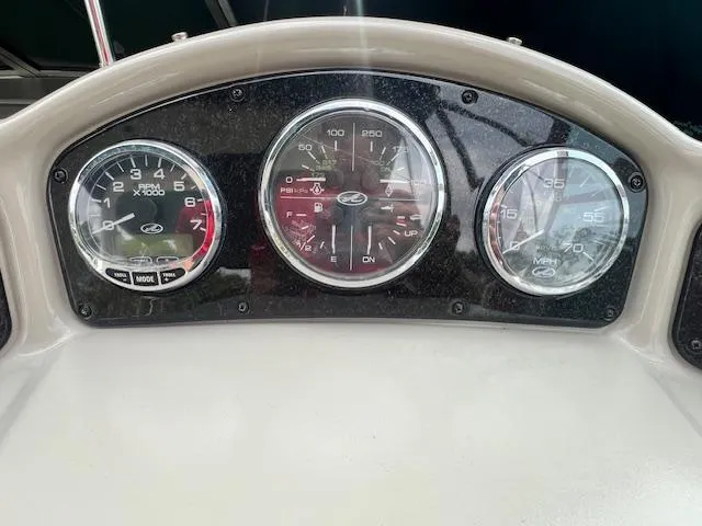 Slide: The Image of Dashboard of a 2005 Sea Ray 260 Sundancer boat with gauges. - 15