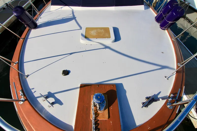 Slide: The Image of 1977 Hatteras 37 Convertible boat deck with anchor and railing. - 17