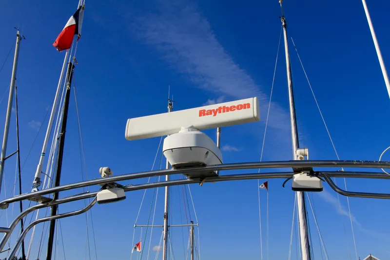 Slide: The Image of Radar system on a 1977 Hatteras 37 Convertible boat against a clear blue sky. - 26