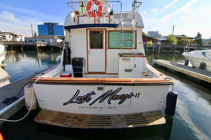 Slide: The Image of 1977 Hatteras 37 Convertible boat docked, named Last Mango II, in Olympia, WA. - 9