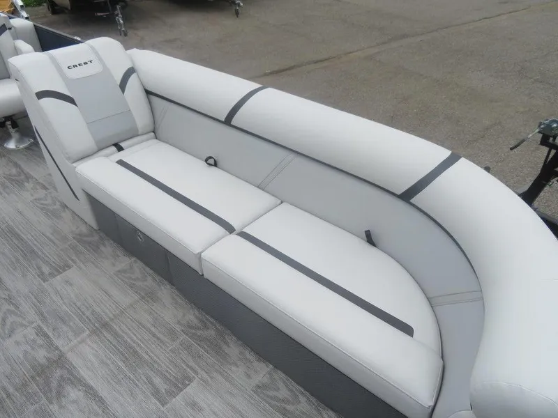 Slide: The Image of 2024 Crest Classic LX 240 SLRC boat with white and gray seating. - 4