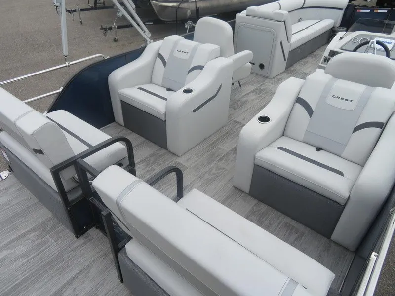 Slide: The Image of 2024 Crest Classic LX 240 SLRC pontoon boat with luxurious seating and modern design. - 9